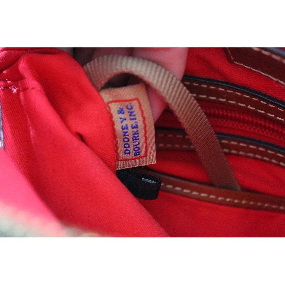Dooney & Bourke Black Pebbled Leather Crossbody Bag with Tan Trim and Red Lining